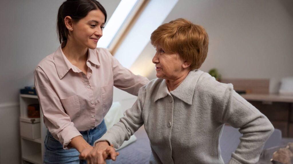 A woman aids an older woman, demonstrating kindness and the value of helping those in need.